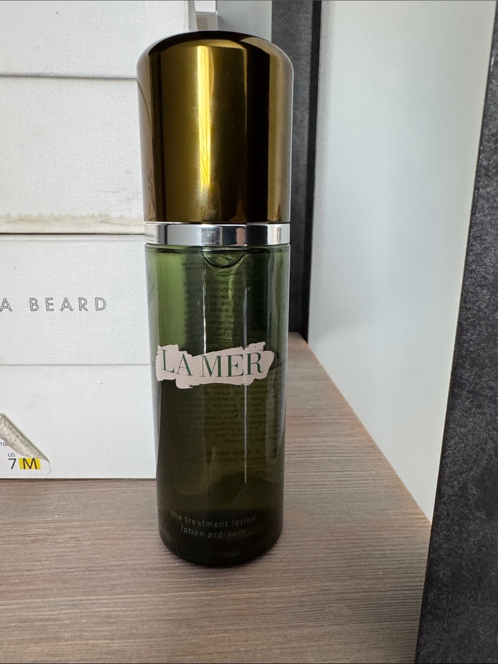 La Mer Green & Gold Treatment Lotion Bottle